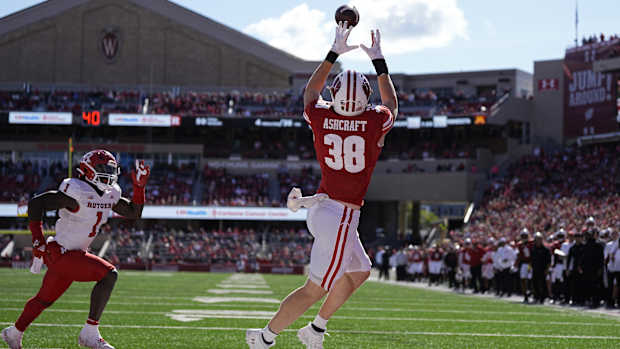 Oct 7, 2023; Madison, Wisconsin, USA; Wisconsin Badgers tight end Tucker Ashcraft (38) catches a pass to score a touchdown during the fourth quarter against the Rutgers Scarlet Knights at Camp Randall Stadium. Mandatory Credit: Jeff Hanisch-USA TODAY Sports